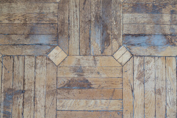 Texture of old worn parquet floor, close up