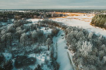Beautiful winter nature. Scenic landscape. Top drone view of forest.