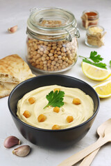 Hummus traditional oriental vegan sauce from chickpea and ingredients. Healthy food