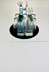 set of glasses and bottles on office desk