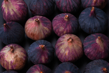 Tasty figs on a black background. Top view.