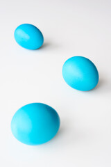 Blue easter eggs, lying on a white background, with copy space. Easter concept.