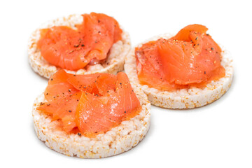 Tasty Rice Cake Sandwiches with Fresh Salmon Slices Isolated on White. Easy Breakfast and Diet Food. Crispbread with Red Fish. Healthy Dietary Snacks - Isolation
