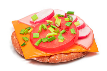 Crispy Cracker Sandwich with Tomato, Sausage, Cheese, Green Onions and Radish - Isolated on White. Easy Breakfast. Diet Food. Quick and Healthy Sandwiches. Crispbread with Tasty Filling - Isolation