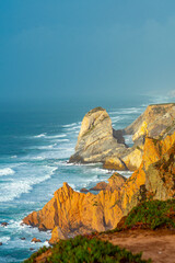 View of the surf of the waves of the atlantic ocean in the city of Nazare Portugal
