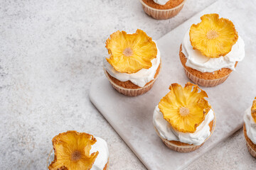 Cupcakes with dried pineapple flowers