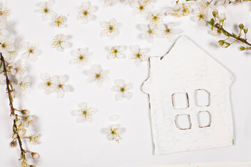 white flower and white house on a white background