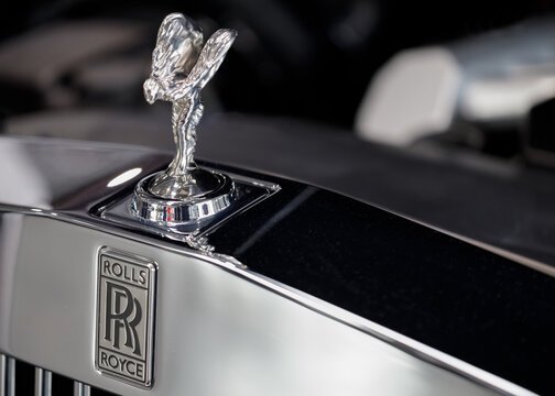 Poland, Poznan - April 08, 2022: Closeup sign of Rolls Royce logo on car Hood ornament on a vintage Rolls Royce car. Rolls-Royce is a British luxury car.