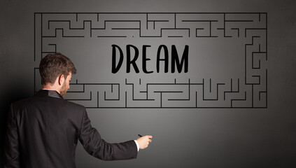 businessman drawing maze concept