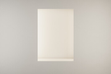 Blank white empty illuminated vertical rectangular niche in light wall with copyspace for your text. 3D rendering, mockup