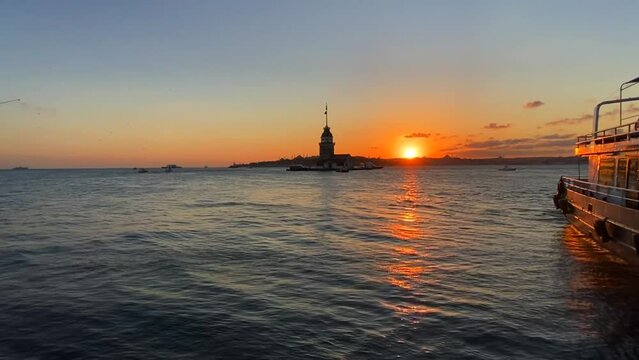 Sun Begins To Set Over Uskudar And Maiden's Tower (Kız Kulesi) With Ships