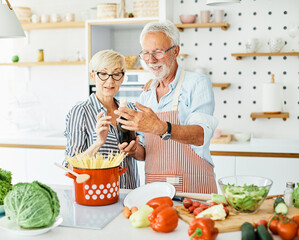 love kitchen senior woman man couple wine glass bottle drink tasting retirement food  husband wife together