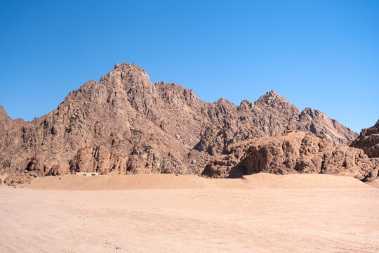 Mountains landscape on background. Sharm el Sheikh, Sinai peninsula. Quadricycle safari park in Egypt sand desert.