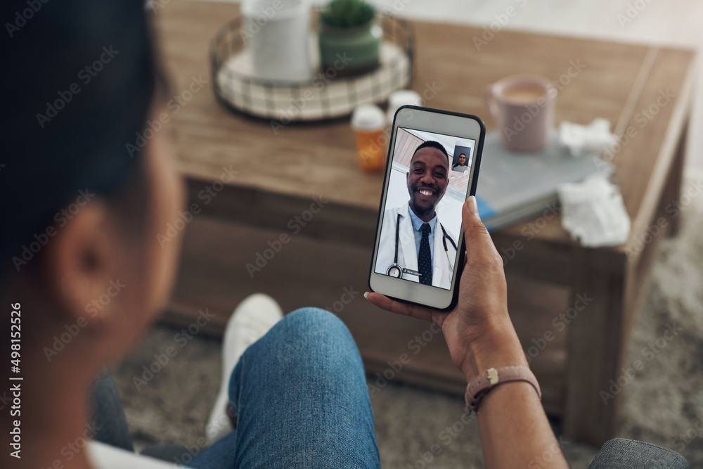 Poster doctors are available at the tap of a finger. shot of an unrecognizable person on a videocall with a