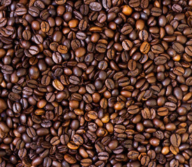 Coffee background. Pile of freshly roasted coffee beans.