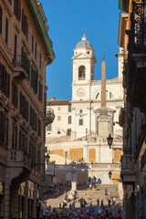 Fototapeta na wymiar Spanish steps and Trinità dei Monti church in Rome. Italy, Europe