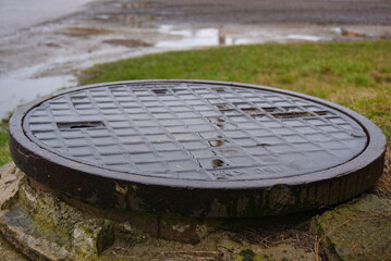 sewage drain in the city center, municipal sewage system