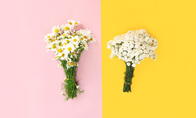 Close up flowers on yellow pink background, flat lay, top view