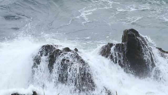 The sea of Cape Kiritafu, Hokkaido. Waves hitting the rocky shore. 