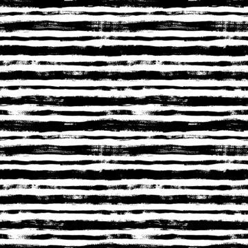 Bold horizontal line brush strokes seamless pattern. Hand drawn vector black lines with grunge texture. Modern fashion background. Grunge brushstrokes design. Ink illustration. Retro striped pattern 