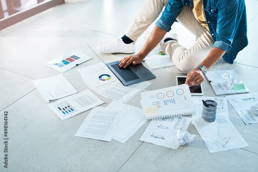 Poster theres quite some data to work through. shot of an unrecognizable businessman brainstorming with a l