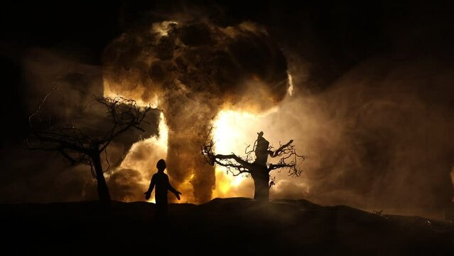 Creative artwork decoration - Russian war in Ukraine concept. Giant explosion of nuclear bomb and people. Selective focus