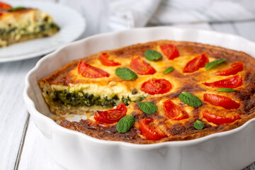 Vegetarian homemade pie, Quiche with tomatoes, spinach and feta cheese, spinach quiche (Turkish...