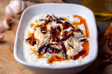 Traditional Turkish and Greek Meze with chili peppers. Turkish Appetizer Atom with yogurt. Turkish atom meze