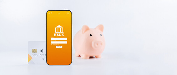 E banking concept. Mobile phone with internet online bank app. Pig bank with credit card on white background. Online wallet save money.
