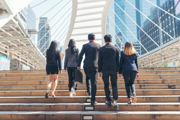 Crowd business people walking go to work in modern city life to working office. Crowd worker group of people busy life with businesswoman,  man in urban street city lifestyle. Business People Concept.