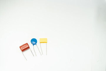 Group of capacitors different sizes isolated on white background. electrolytic capacitors