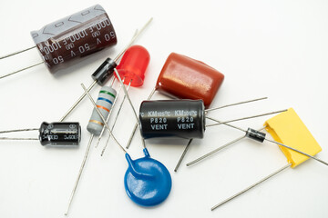 Group of various electronic components: diode, capacitors, resistors, LEDs. isolated on white background - obrazy, fototapety, plakaty