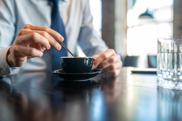 Businessman having morning coffee in a cafe