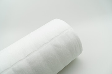 Universal white fabric napkins for cleaning in a roll. Bobbin with napkins for dispenser. Selective focus