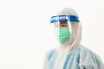 Closeup woman medical staff doctor in PPE uniform wearing a face mask protective and plastic face shield for quarantine Coronavirus outbreak (COVID-19) isolated on white background