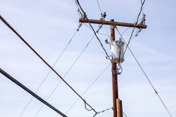 High voltage electricity pole with power lines