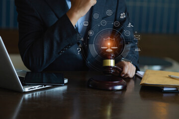 Concepts of Law and Legal services. Lawyer working with law interface icons. Blurred background.	