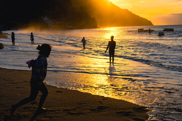 Enjoying summer at the beach of Puerto Galera, Philippines at sunset