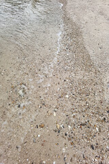 Wave of the sea on the sand beach