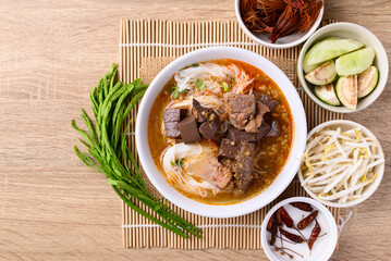 Northern Thai food, Spicy rice noodles soup with pork eating with fresh vegetables, Local Thai food
