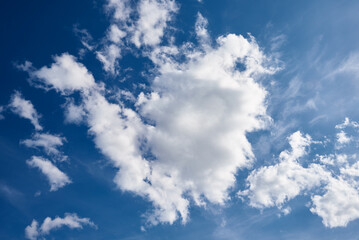 White cumulus clouds in blue sky, beautiful cloudscape background