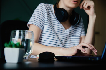 Caucasian woman working with laptop at home office workplace. Freelancer remote work