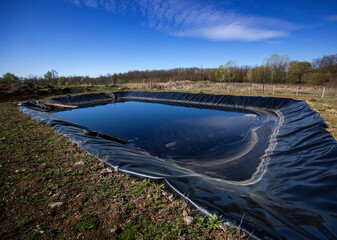 Insulated leachate pond with dirty water, part of landfill - obrazy, fototapety, plakaty