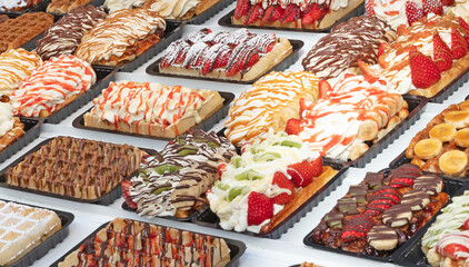 Fresh Brussels wafers or gaufres with fresh cream and fruits