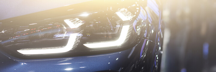 The beautiful car headlights in showroom car.