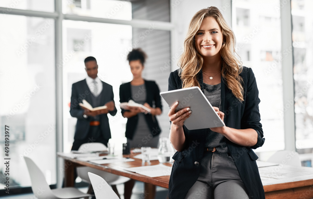 Wall mural it helps me discover gaps in the market to capitalize on. portrait of a young businesswoman using a 