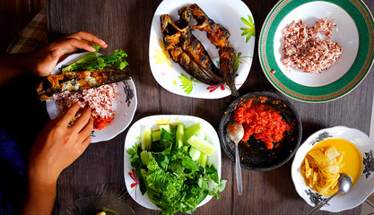 Enjoy lunch with fried catfish and fresh vegetables