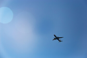 Passenger plane in the blue sky - Air travel