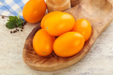 Sweet ripe yellow tomato in the bowl