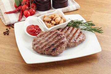 Grilled beef burger cutlet with sauce
